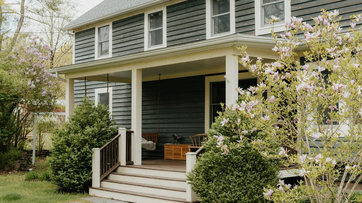 a house with a porch and steps leading to the front door