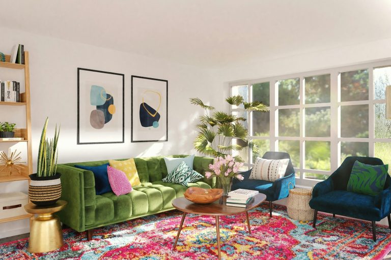 Bright living room with a green velvet sofa, colorful pillows and pink flowers